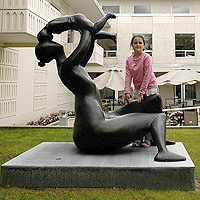 Mother Lifting Child